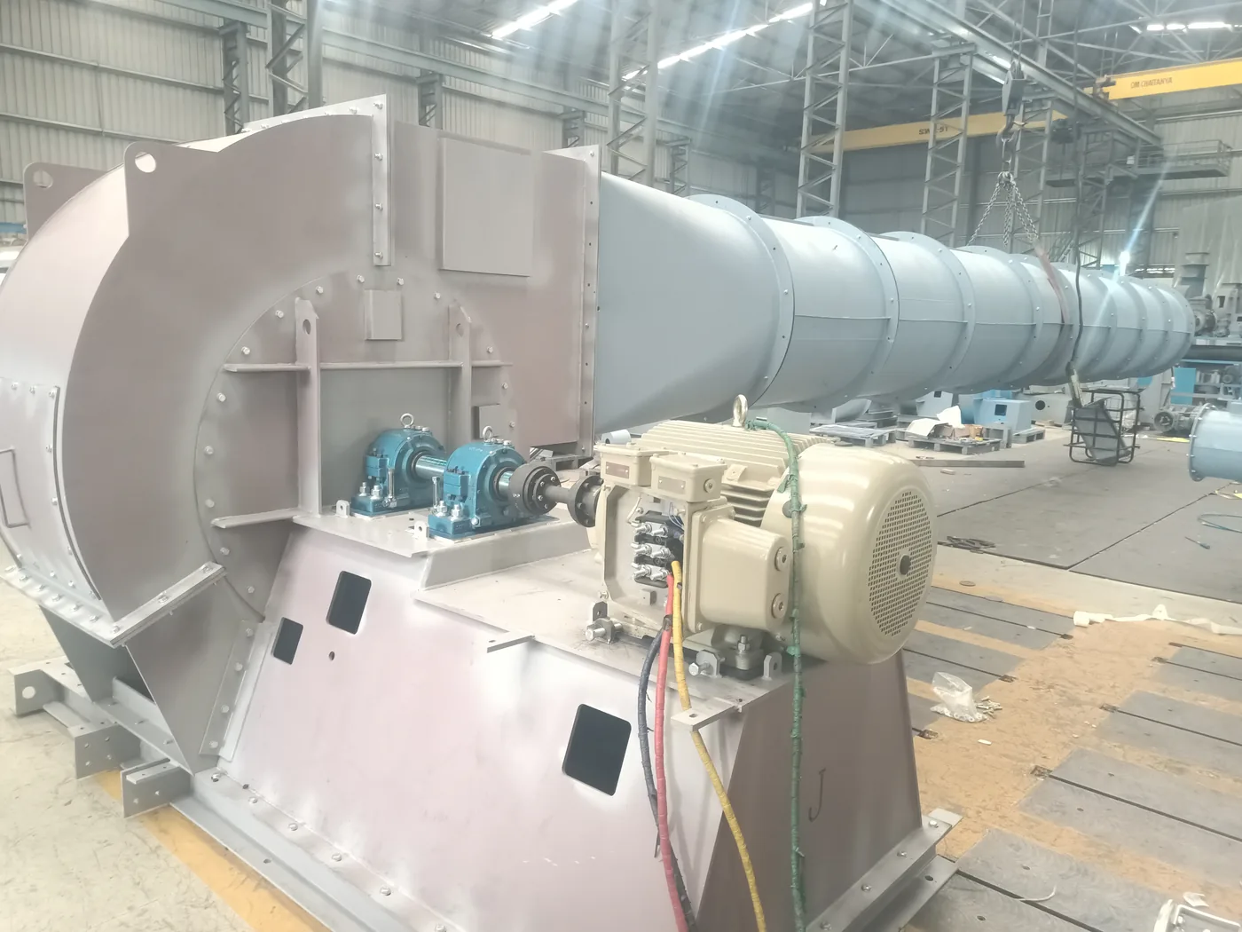 The drive side of the same blower - bearing pedestals, coupling and motor on the fabricated base