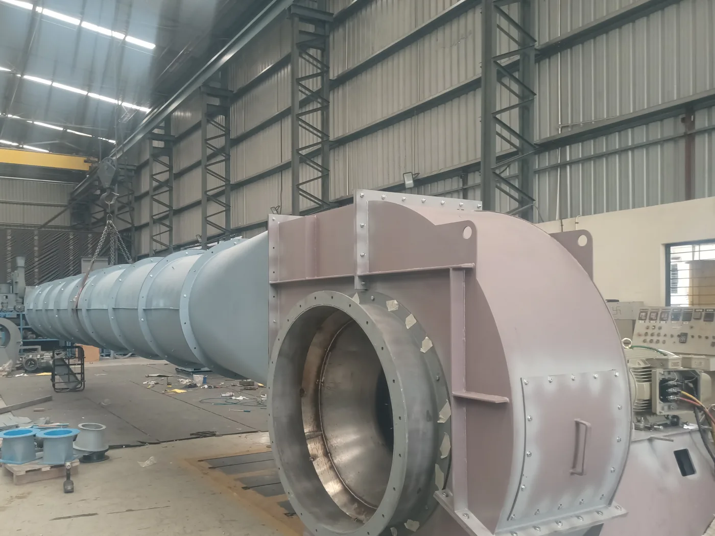 A large aerofoil centrifugal blower coupled to its test ducting on the Jitamitra test bed