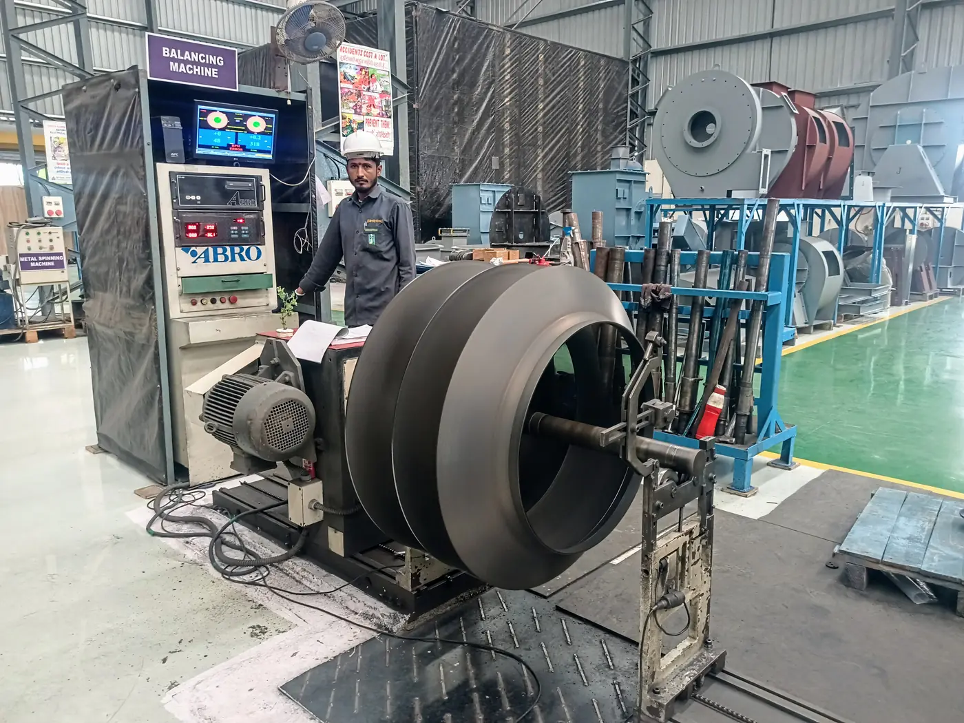 A large double-inlet impeller mounted on the dynamic balancing machine