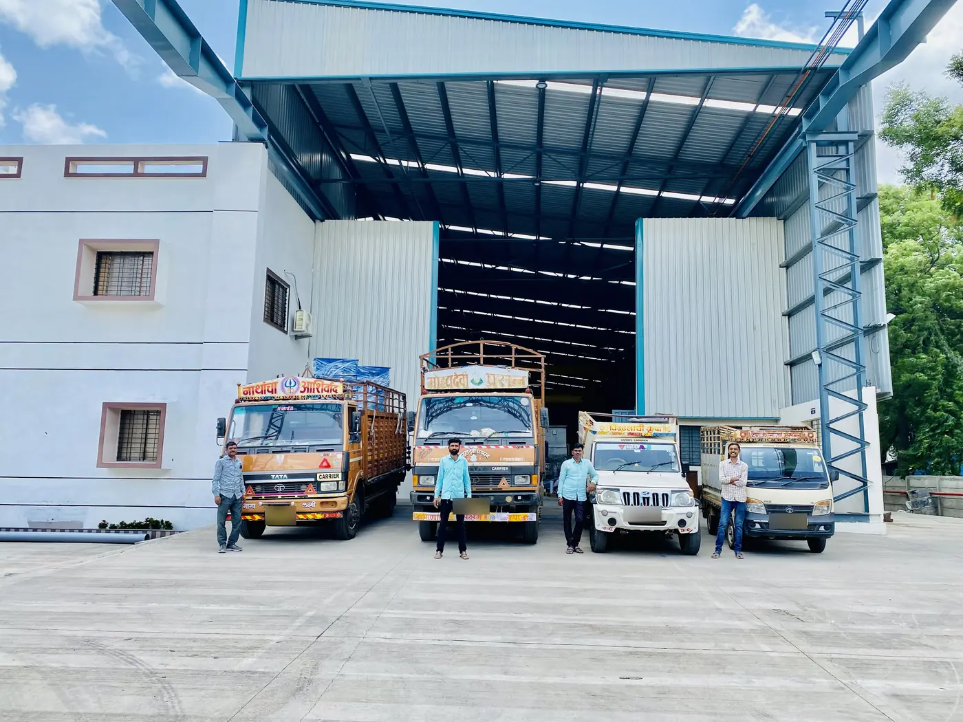 Trucks drawn up at the works door, loading finished fans for dispatch